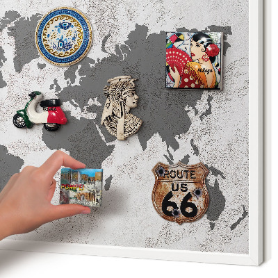 Magnetic board for travel magnets in a white frame World map