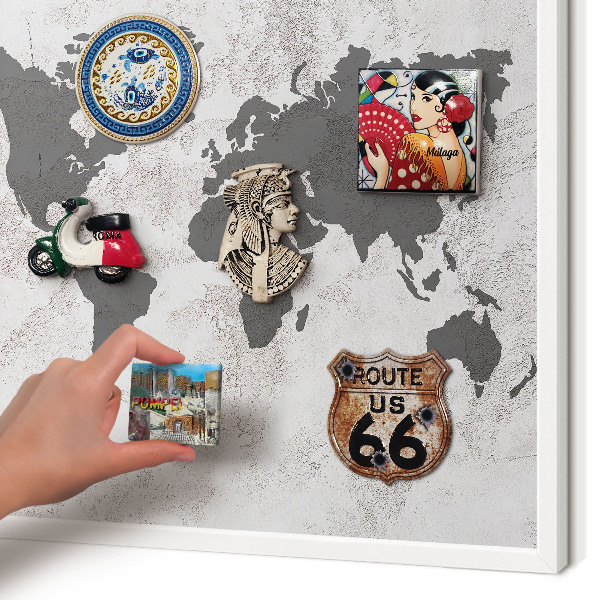 Magnetic board for travel magnets in a white frame World map