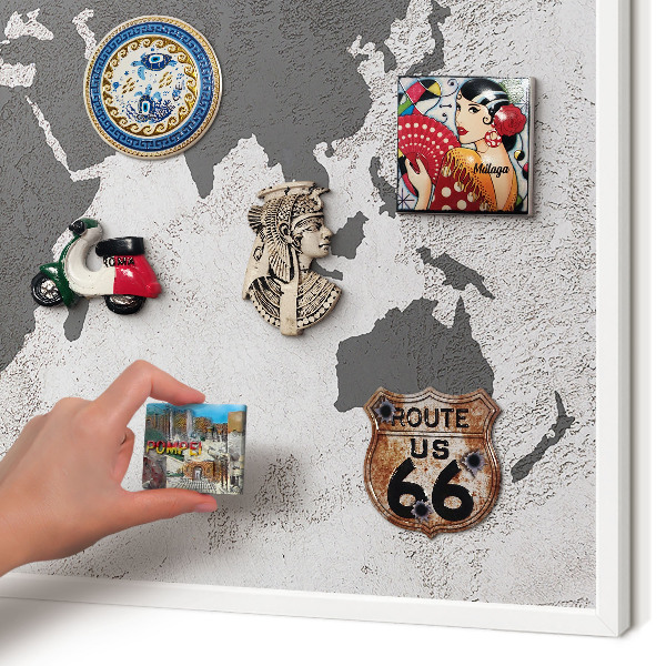 Magnetic board for travel magnets in a white frame World map