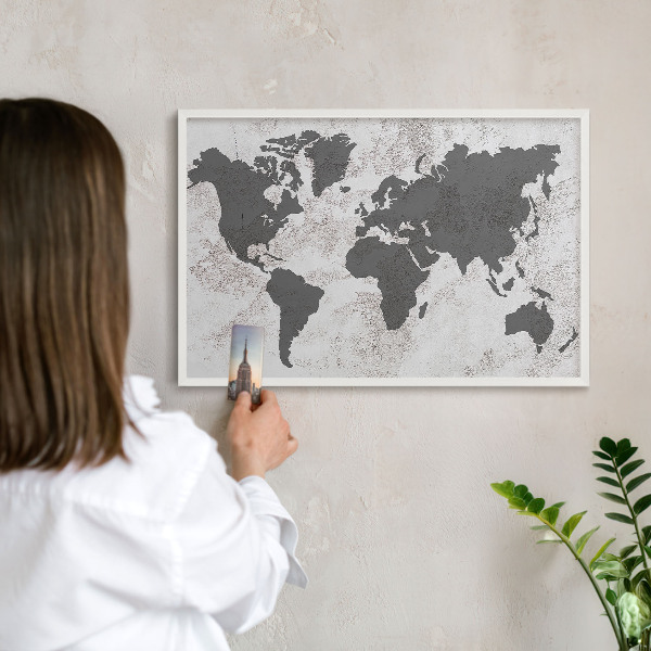 Magnetic board for travel magnets in a white frame World map