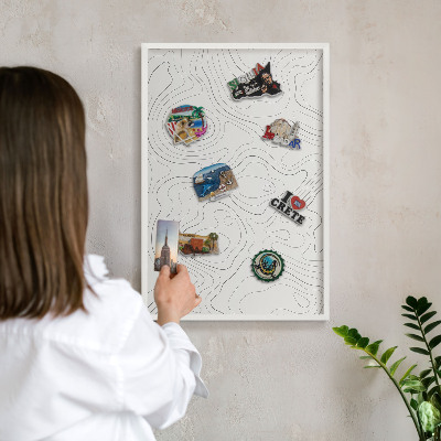 Magnetic board for travel magnets in a white frame Geometric elegance