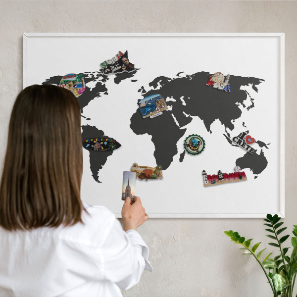 Magnetic board for travel magnets in a white frame World map