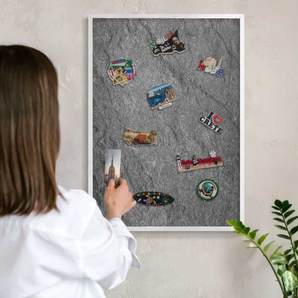 Magnetic board for travel magnets in a white frame Gray stone