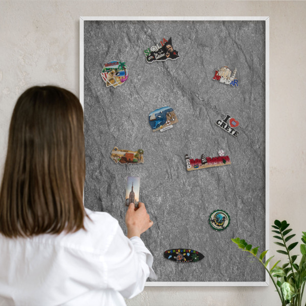 Magnetic board for travel magnets in a white frame Gray stone