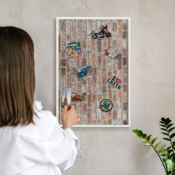 Decorative magnet board with a white frame Brick wall