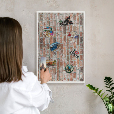 Decorative magnet board with a white frame Brick wall