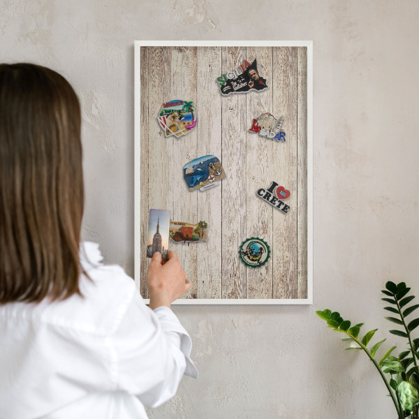 Magnetic board for travel magnets in a white frame Wooden texture