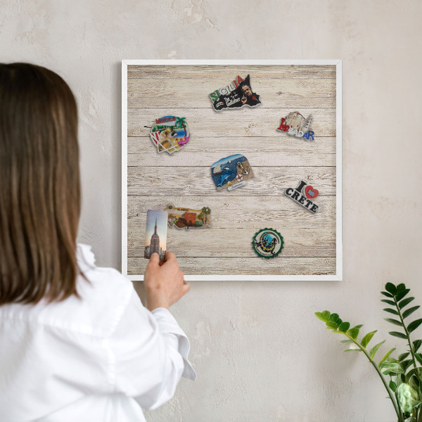 Magnetic board for travel magnets in a white frame Wooden texture