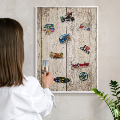 Magnetic board for travel magnets in a white frame Wooden texture