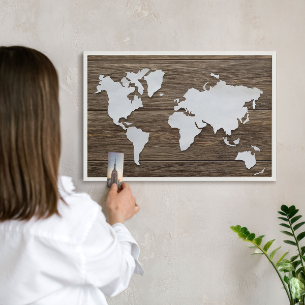 Magnetic board for travel magnets in a white frame Wooden map