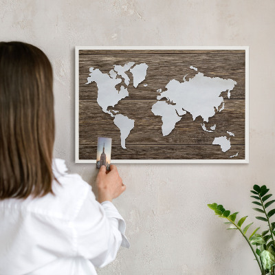Magnetic board for travel magnets in a white frame Wooden map