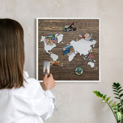 Magnetic board for travel magnets in a white frame Wooden map
