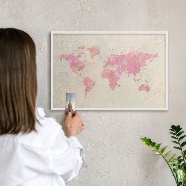 Magnetic board for travel magnets in a white frame World map
