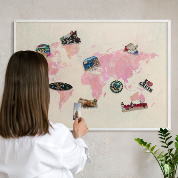 Magnetic board for travel magnets in a white frame World map