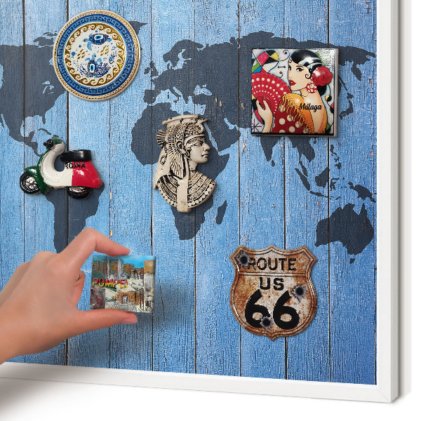 Magnetic board for travel magnets in a white frame World map