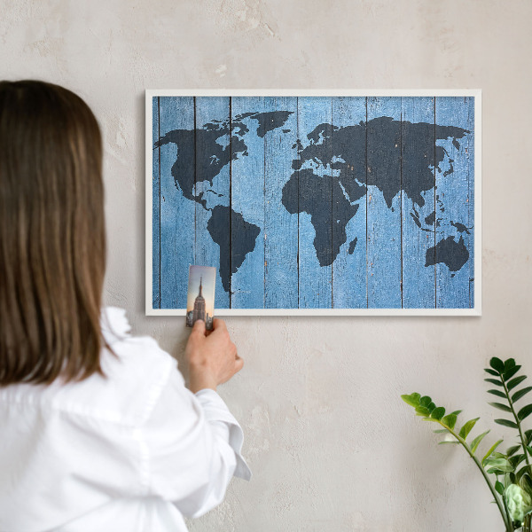 Magnetic board for travel magnets in a white frame World map