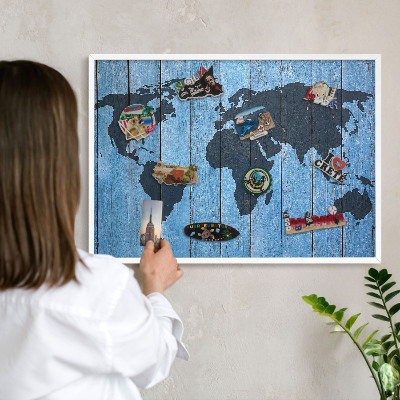 Magnetic board for travel magnets in a white frame World map