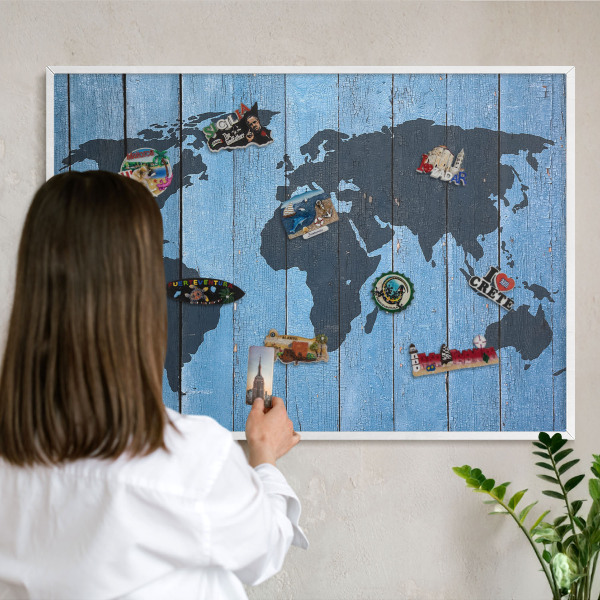Magnetic board for travel magnets in a white frame World map