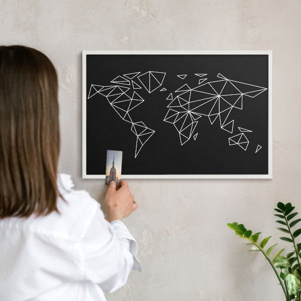 Magnetic board for travel magnets in a white frame World map