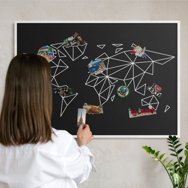 Magnetic board for travel magnets in a white frame World map