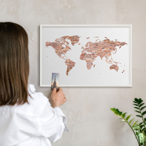 Decorative magnet board with a white frame Brick map