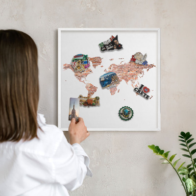 Decorative magnet board with a white frame Brick map