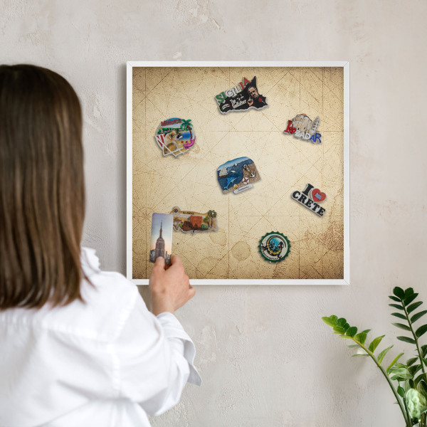 Magnetic board for travel magnets in a white frame Ancient map