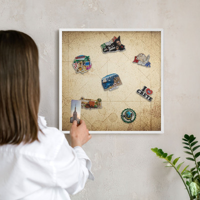 Magnetic board for travel magnets in a white frame Ancient map