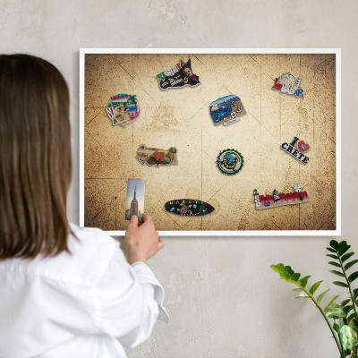 Magnetic board for travel magnets in a white frame Ancient map