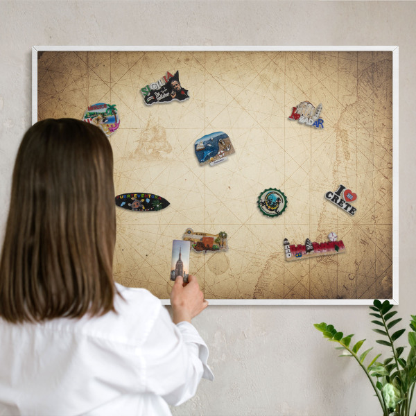 Magnetic board for travel magnets in a white frame Ancient map