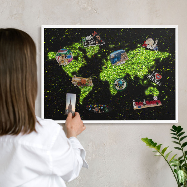 Magnetic board for travel magnets in a white frame Green map