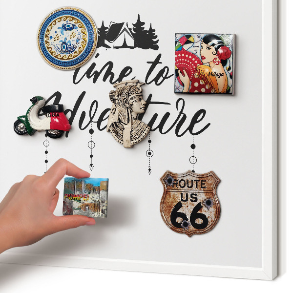 Magnetic board for travel magnets in a white frame Adventure awaits