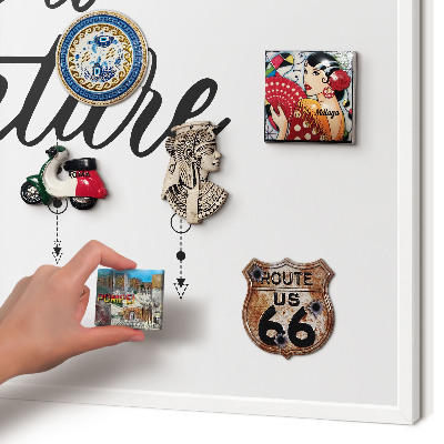 Magnetic board for travel magnets in a white frame Adventure awaits