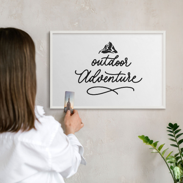 Magnetic board for travel magnets in a white frame Mountain adventure