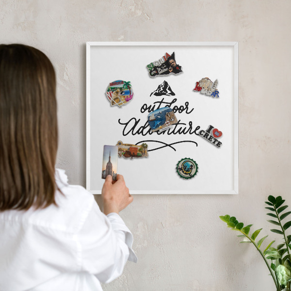 Magnetic board for travel magnets in a white frame Mountain adventure