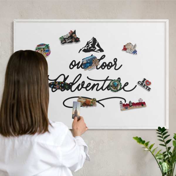 Magnetic board for travel magnets in a white frame Mountain adventure