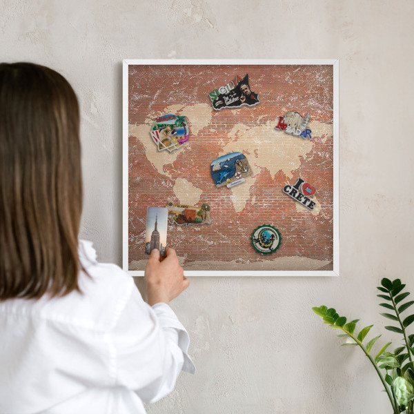 Decorative magnet board with a white frame Brick map