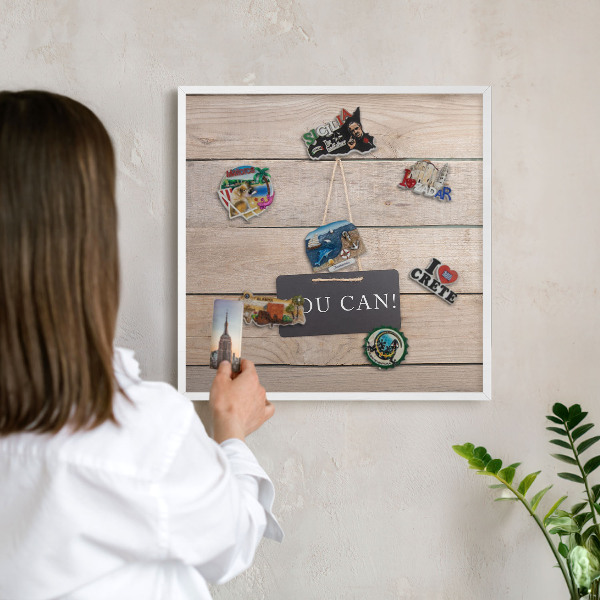 Magnetic board for travel magnets in a white frame Motivation every day