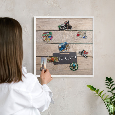 Magnetic board for travel magnets in a white frame Motivation every day