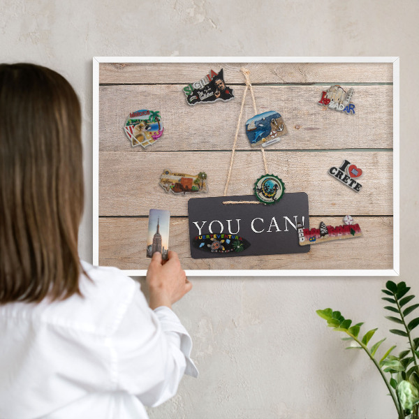 Magnetic board for travel magnets in a white frame Motivation every day