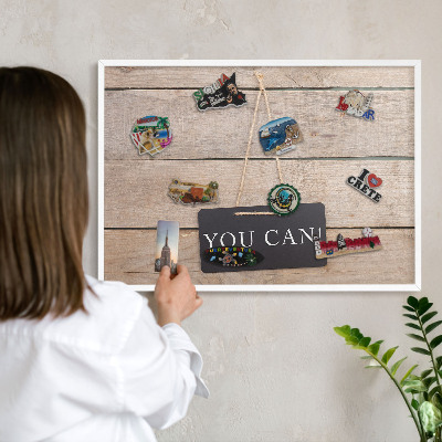 Magnetic board for travel magnets in a white frame Motivation every day