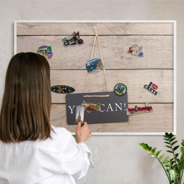 Magnetic board for travel magnets in a white frame Motivation every day
