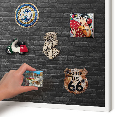 Magnetic board for travel magnets in a white frame Brick wall