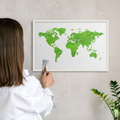 Magnetic board for travel magnets in a white frame Green map