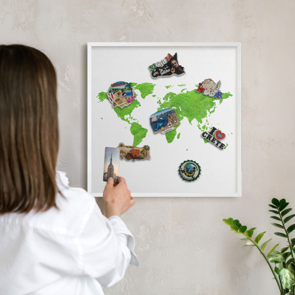 Magnetic board for travel magnets in a white frame Green map