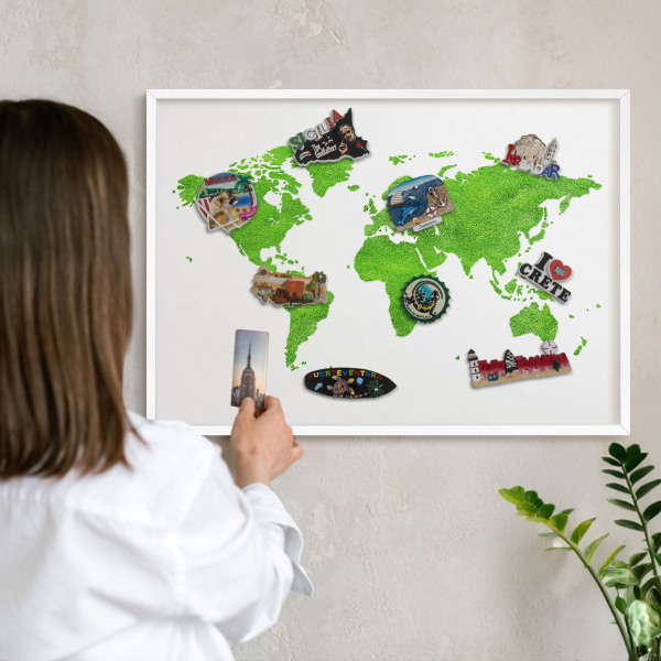 Magnetic board for travel magnets in a white frame Green map