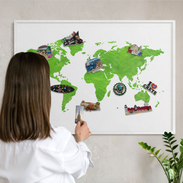 Magnetic board for travel magnets in a white frame Green map