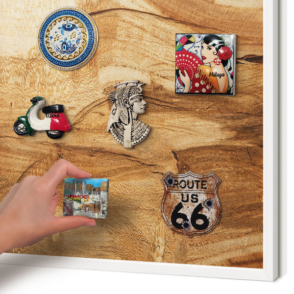 Magnetic board for travel magnets in a white frame Natural wood