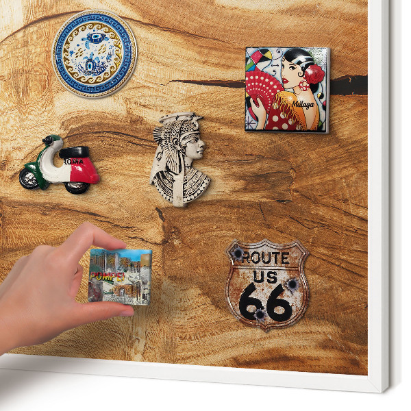 Magnetic board for travel magnets in a white frame Natural wood