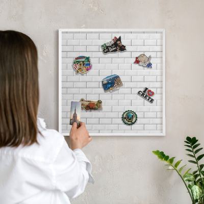 Magnetic board for travel magnets in a white frame White bricks